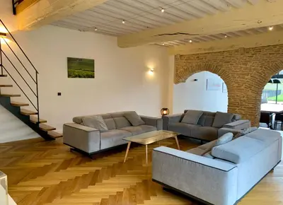 Coin salon dans l'établissement Aux Cortons - Maison avec vue sur le vignoble