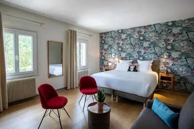 Un ou plusieurs lits dans un hébergement de l'établissement Hôtel Restaurant Gastronomique La Huchette