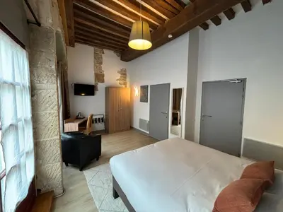 Télévision ou salle de divertissement dans l'établissement Hotel Le Jacquemart