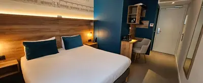 Un ou plusieurs lits dans un hébergement de l'établissement Hôtel des Halles
