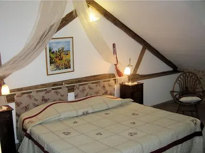 Un ou plusieurs lits dans un hébergement de l'établissement B&B Les Cistelles