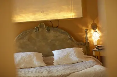 Un ou plusieurs lits dans un hébergement de l'établissement Olivier Leflaive Hôtel Restaurants
