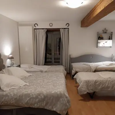 Un ou plusieurs lits dans un hébergement de l'établissement Chambre d'Hôtes Familiale la Jument Grise
