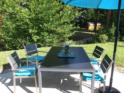 Jardin de l'établissement LES GITES DU PARC KOTA DOUBLE climatisé