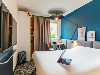 Un ou plusieurs lits dans un hébergement de l'établissement ibis Nuits Saint Georges