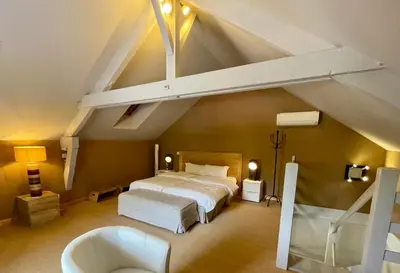 Un ou plusieurs lits dans un hébergement de l'établissement Chambres d'Hôte Le Clos de L'Argolay