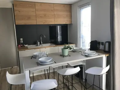 Cuisine ou kitchenette dans l'établissement Le Lodge Premium