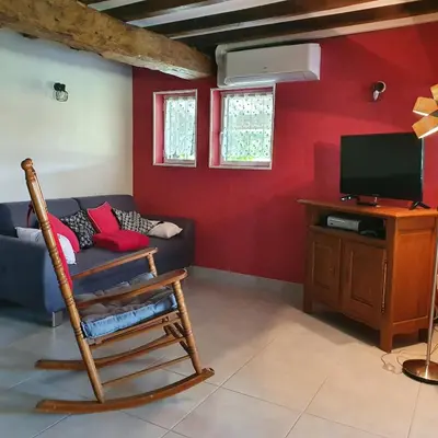 Télévision ou salle de divertissement dans l'établissement une Pause à la Campagne