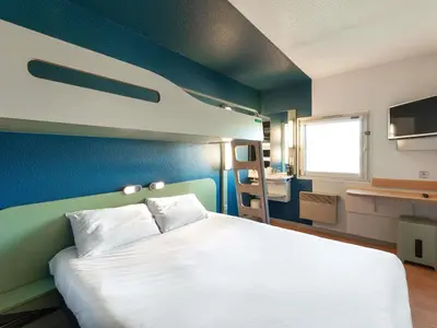 Un ou plusieurs lits dans un hébergement de l'établissement ibis budget Mâcon Nord