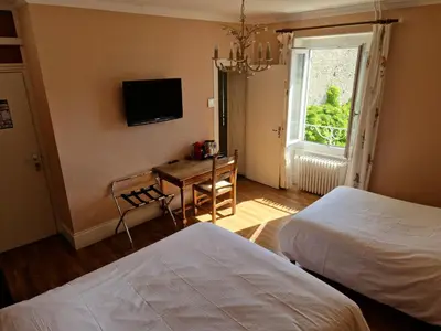 Un ou plusieurs lits dans un hébergement de l'établissement Hôtel De La Ferté