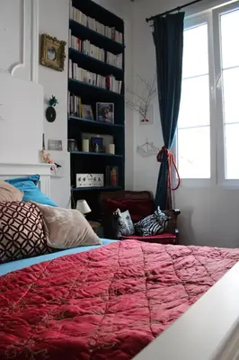 Un ou plusieurs lits dans un hébergement de l'établissement Le Boudoir d'artiste