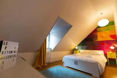 Un ou plusieurs lits dans un hébergement de l'établissement APPARTEMENT LE VITAMINE - topbnb dijon