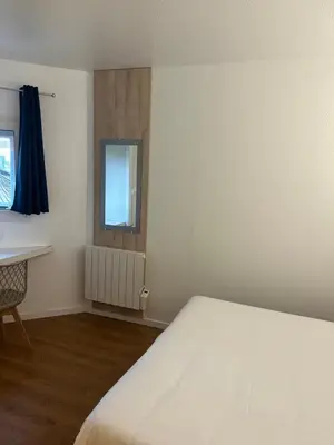 Un ou plusieurs lits dans un hébergement de l'établissement Kyriad Direct Macon Sud