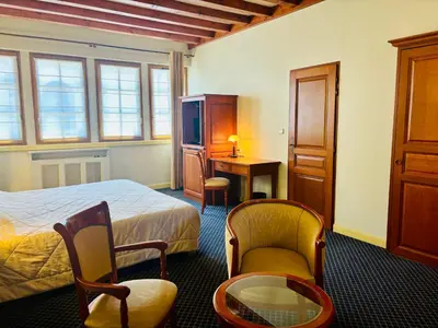 Un ou plusieurs lits dans un hébergement de l'établissement Hôtel Losset
