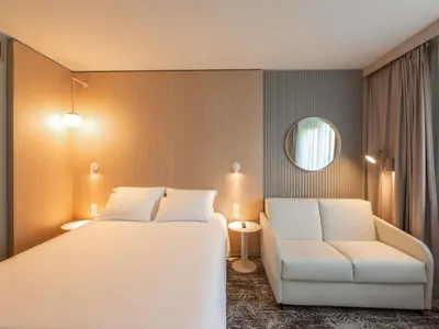 Un ou plusieurs lits dans un hébergement de l'établissement Novotel Macon Nord - Porte de Bourgogne