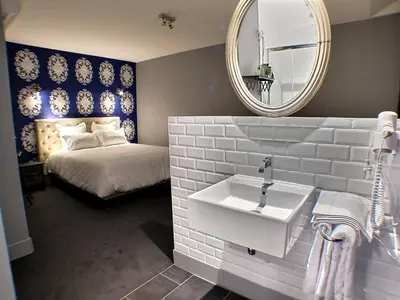 Un ou plusieurs lits dans un hébergement de l'établissement Hôtel 19'Cent
