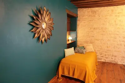 Un ou plusieurs lits dans un hébergement de l'établissement Gîte Design