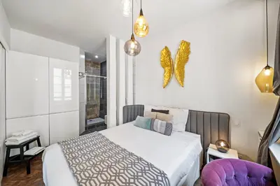 Un ou plusieurs lits dans un hébergement de l'établissement La Suite Indivio - Appartement standing vue cathédrale