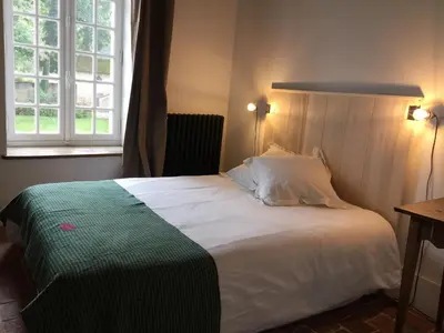 Un ou plusieurs lits dans un hébergement de l'établissement Orangerie du chateau de Quemigny sur Seine