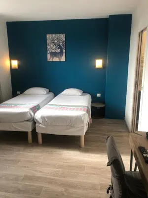 Un ou plusieurs lits dans un hébergement de l'établissement Hôtel de Paris - Dijon Centre Gare