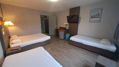 Un ou plusieurs lits dans un hébergement de l'établissement Hotel Val Vert