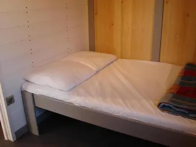Un ou plusieurs lits dans un hébergement de l'établissement Camping Moulin de Collonge