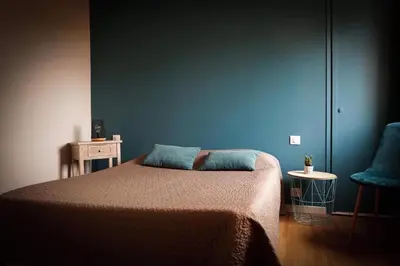 Un ou plusieurs lits dans un hébergement de l'établissement Hôtel Les Jardins du Lac