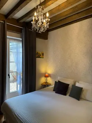 Un ou plusieurs lits dans un hébergement de l'établissement Maison d'hôtes Fleurs de Vignes