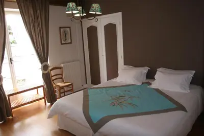 Un ou plusieurs lits dans un hébergement de l'établissement Maison d'hôtes Fleurs de Vignes