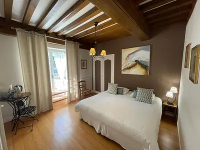 Un ou plusieurs lits dans un hébergement de l'établissement Maison d'hôtes Fleurs de Vignes