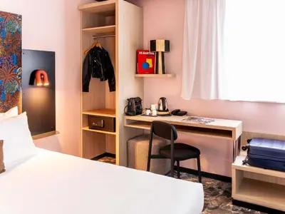 Un ou plusieurs lits dans un hébergement de l'établissement Ibis Styles Dijon Nord Valmy