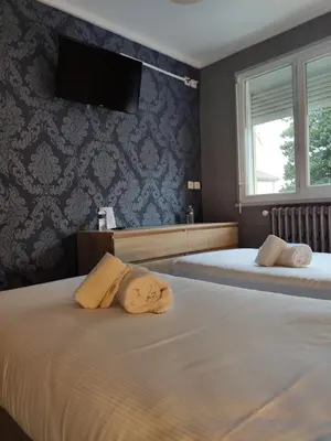 Un ou plusieurs lits dans un hébergement de l'établissement BAR HOTEL DU CENTRE (BDC)