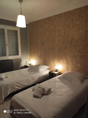 Un ou plusieurs lits dans un hébergement de l'établissement BAR HOTEL DU CENTRE (BDC)