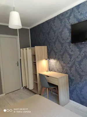Télévision ou salle de divertissement dans l'établissement BAR HOTEL DU CENTRE (BDC)