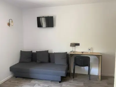 Coin salon dans l'établissement Logis Les Charmilles Chalon-sur-Saône Sud
