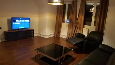 Télévision ou salle de divertissement dans l'établissement Bel appartement en plein coeur de ville