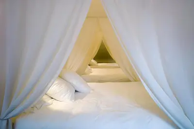 Un ou plusieurs lits dans un hébergement de l'établissement La Maison Blanche