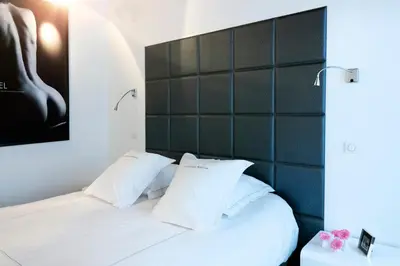 Un ou plusieurs lits dans un hébergement de l'établissement La Maison Blanche