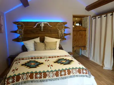 Un ou plusieurs lits dans un hébergement de l'établissement Gîte Les Hauts de Morey - Aux Amoureuses
