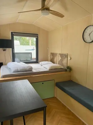 Un ou plusieurs lits dans un hébergement de l'établissement CAMPING LES HERLEQUINS