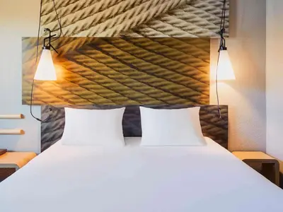 Un ou plusieurs lits dans un hébergement de l'établissement Hotel ibis Dijon Centre Clemenceau