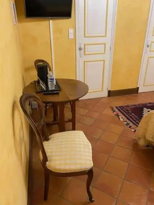 Télévision ou salle de divertissement dans l'établissement Au temps d'Autrefois