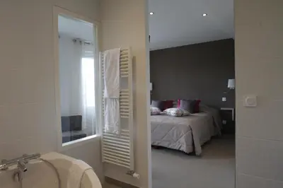 Un ou plusieurs lits dans un hébergement de l'établissement Hostellerie Saint Germain