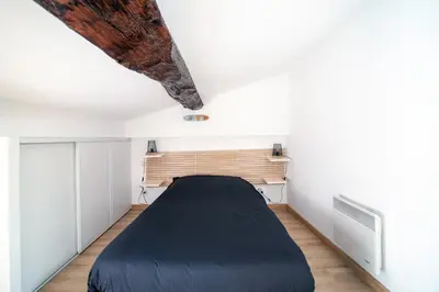 Un ou plusieurs lits dans un hébergement de l'établissement Myappart71 - Appartement - cosy au centre ville