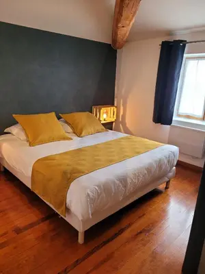 Un ou plusieurs lits dans un hébergement de l'établissement Les chambres de la Cotinière - Bord de Saône - St Jean de Losne