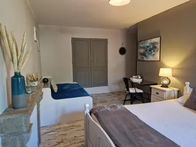 Un ou plusieurs lits dans un hébergement de l'établissement Chambres d'hôtes Une autre maison