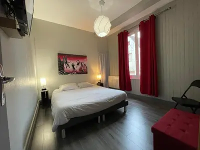 Un ou plusieurs lits dans un hébergement de l'établissement Appartements chez Delphine et Guillaume au coeur de Semur en Auxois