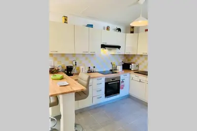 Cuisine ou kitchenette dans l'établissement Petit Blanc