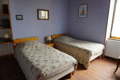 Un ou plusieurs lits dans un hébergement de l'établissement Gîte des Grands Narreaux