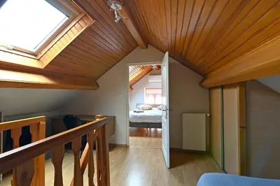 Un ou plusieurs lits dans un hébergement de l'établissement La Petite Maison Blanzy